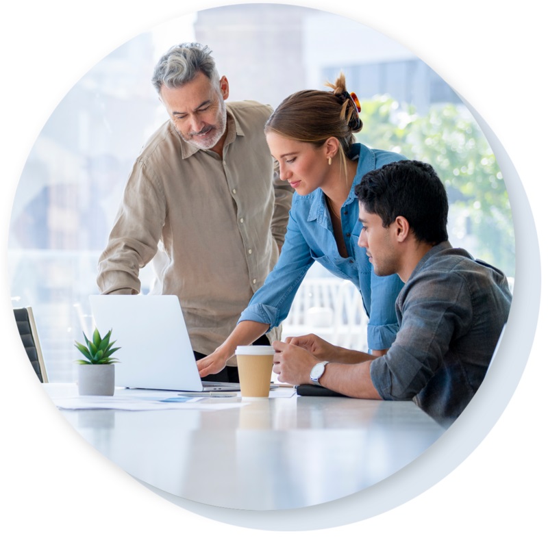 Group of people looking at a laptop